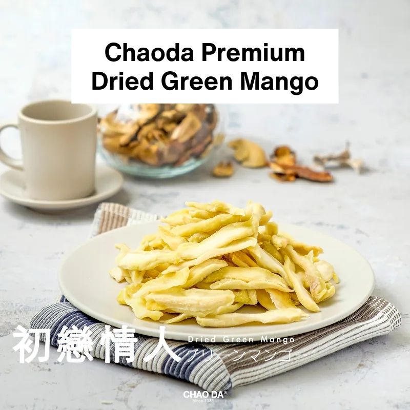 Dried green mango on a plate with a cup and bowl in the background, featuring Chaoda Premium brand.