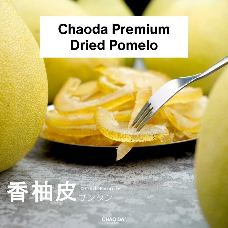 Dried pomelo slices with a fork and whole pomelos, branded 'Chaoda Premium'.