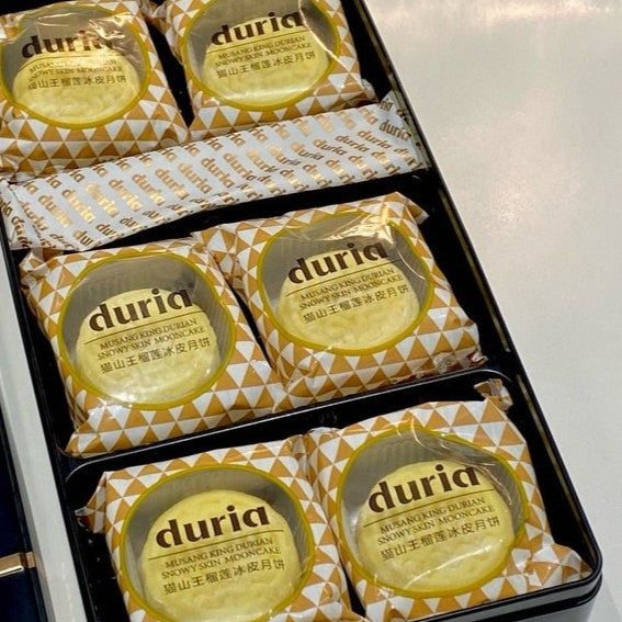 Packaged Duria mooncakes in a box on a white surface