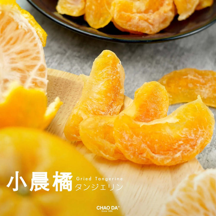 Dried tangerine slices on a wooden board with a blurred background