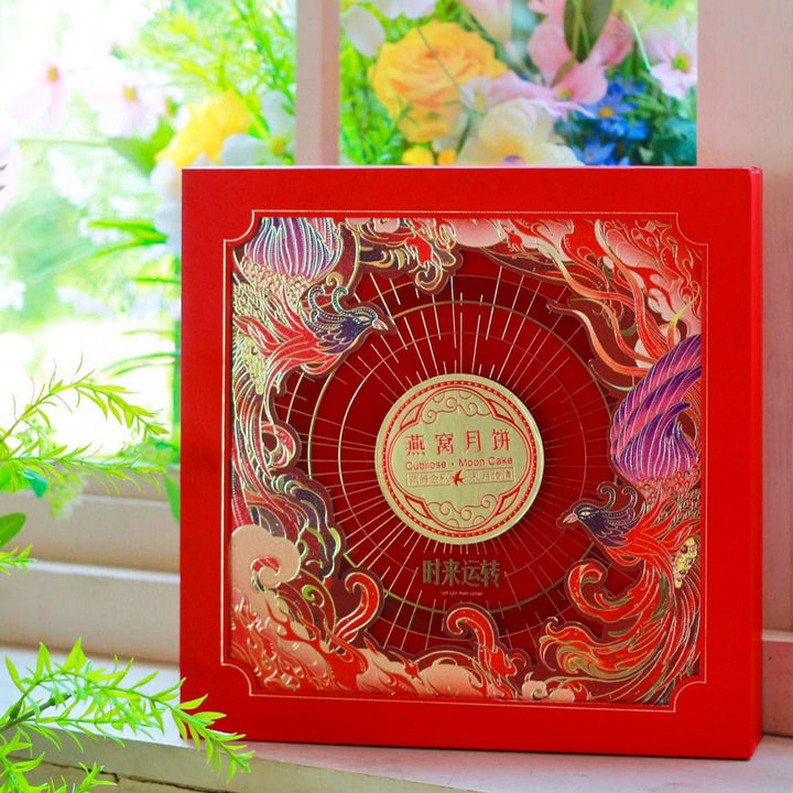 Decorative red box with intricate designs on a light background