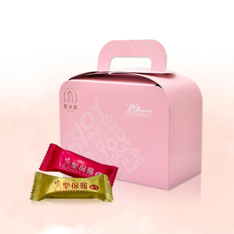 Pink gift box with two candy packages on a light pink background