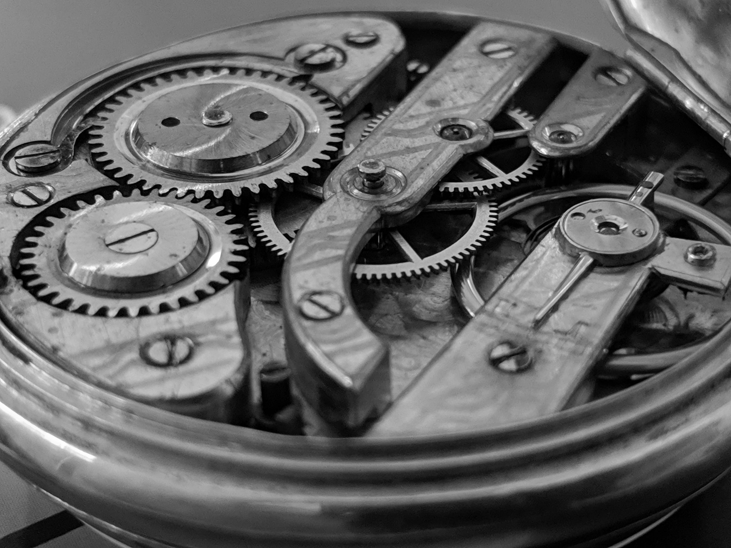 OPEN-TIMEPIECE-EXPOSING-COGS-AND-GEAR-WHEELS